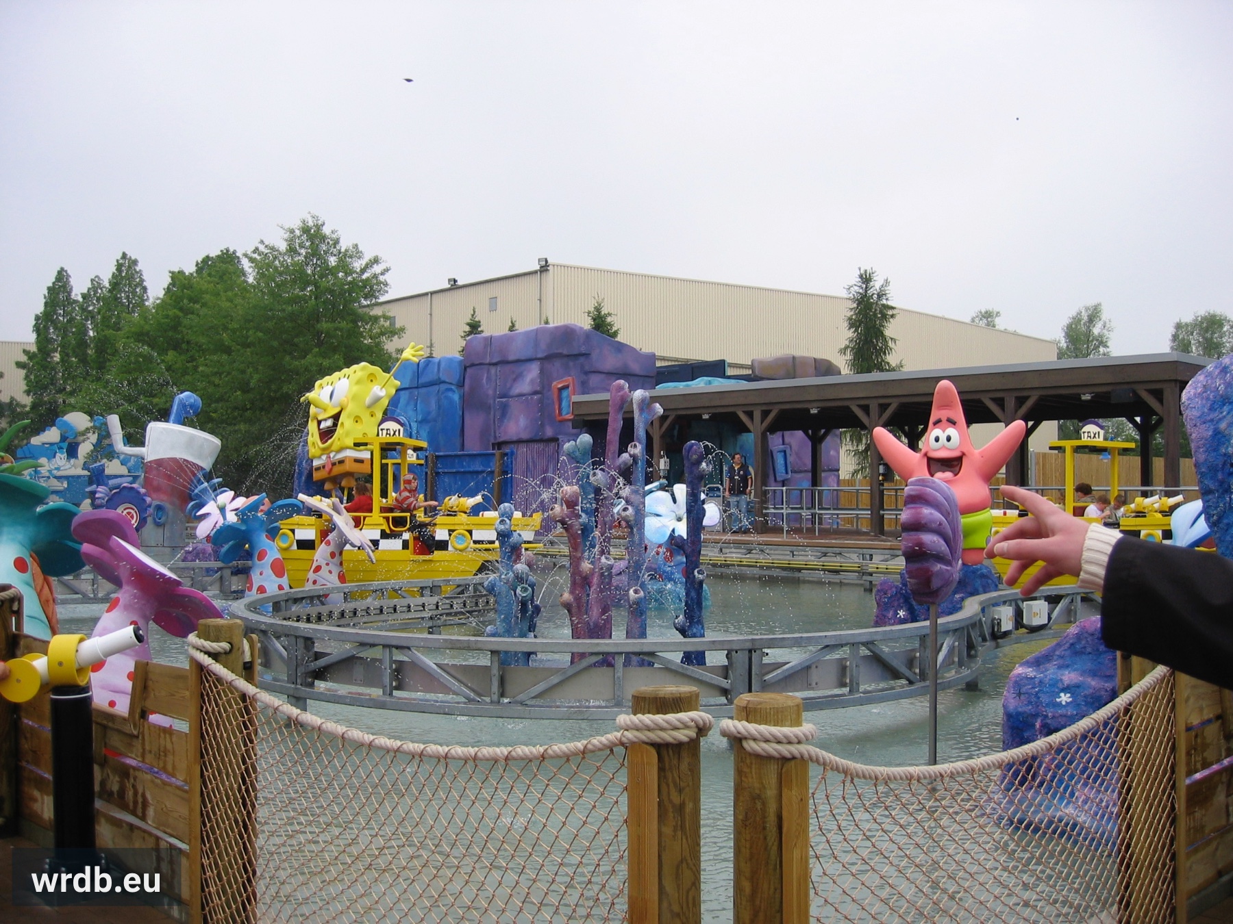 A boat on a part of the track, surrounded by theming elements.